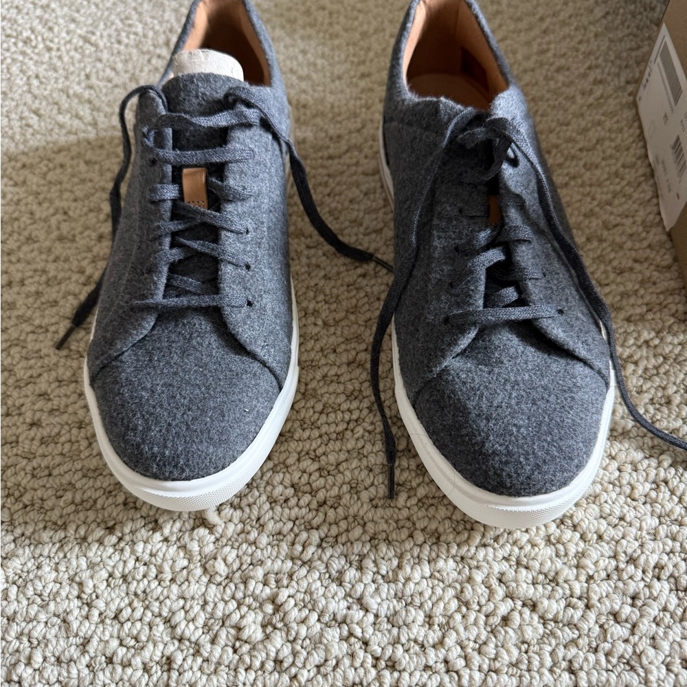 Grey material sneakers. Size 8. Never been worn. Still in the box.